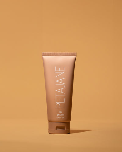 tan extender lotion tube by Peta Jane beauty on a tan background